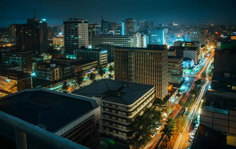 City at night seen from above with lit street grid